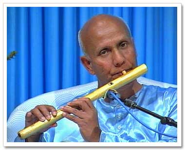 Sri Chinmoy playing meditative flute music